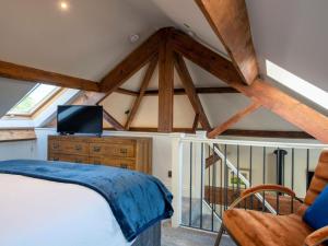 a bedroom with a bed and a chair at 1 Bed in Richmond oc-88588 in Easby +26 photos