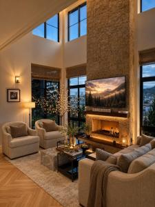 a large living room with a fireplace and a stone wall at Light House Villa in Da Lat