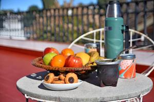 a table topped with a basket of fruit and nuts at Residencial Garcia in Embalse