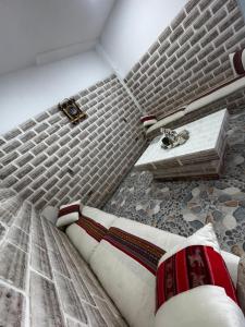 a bedroom with a bed and a sink in a room at Asian House in Uyuni