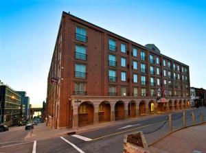 a large red brick building on a city street at Residence Inn by Marriott Halifax Downtown in Halifax