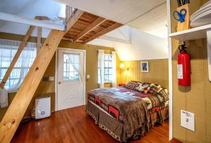 a bedroom with a large bed in a attic at Hilltop Loft in Helen