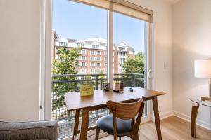 a room with a desk and a large window at Modern Apt Downtown with Pool in Stamford