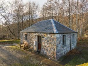 a small stone building on the side of a road at 1 Bed in Applecross oc-ca186 in Applecross