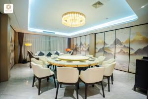 a dining room with a table and chairs at Ocean Delight Boutique Hotel 海悦精品酒店 in Sihanoukville