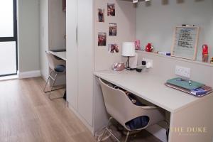 an office with a white desk and two chairs at The Duke Maynooth in Maynooth