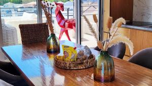 a table with three bottles and a basket of food at A l'aube de Bali in Amnéville +16 photos