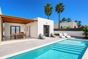 an image of a villa with a swimming pool at Villa Salty Sun 6 in Kremasti