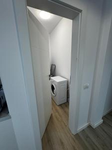 a small bathroom with a toilet in a room at VISAJ Escape in Timişoara +26 photos