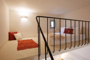 a bedroom with a bed with a metal crib at Eos Milos House in Pollonia