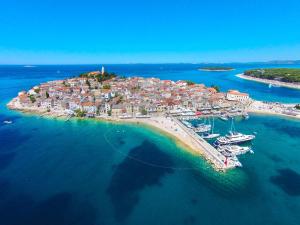 an aerial view of a small island in the water at Apartments Ziva in Primošten +40 photos