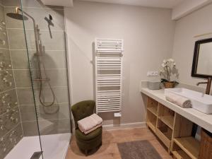 a bathroom with a shower and a sink at Maison de Centre ville in Limoux +37 photos