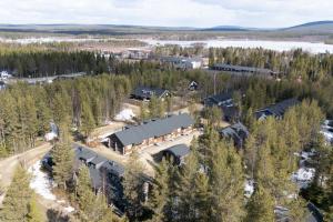 an aerial view of a house in a forest at ÄkäsLuppo - Valkea Homes in Kittilä