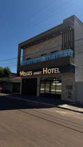 a building with a mlas agent hotel on it at Melges Apart Hotel in Pontes e Lacerda