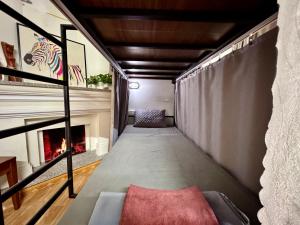 a living room with a couch and a fireplace at Hava Hostel Lang Son in Lạng Sơn