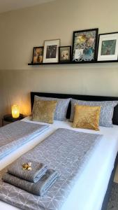 a bedroom with a large bed with a blue light at Sunrise Apartment in Schladming