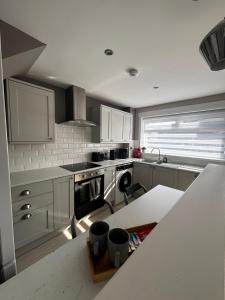 a kitchen with stainless steel appliances and a counter top at Caol Mountain View in Caol