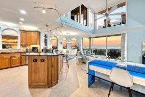 an open kitchen and living room with a view of the ocean at Admirals Watch - 673 in Siesta Key