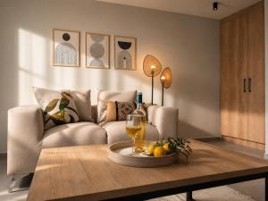 a living room with a couch and a table at AISTHISIS Suites in Ierissos