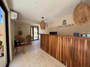 a lobby of a hotel lobby with a reception counter at Hotel Boutique Alcalá Vallarta in Puerto Vallarta