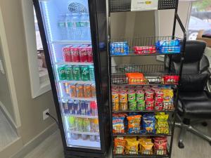 a refrigerator filled with lots of soda and drinks at Red Roof Inn Green Brook - Somerset in Green Brook