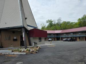 an empty parking lot in front of a motel at Red Roof Inn Green Brook - Somerset in Green Brook
