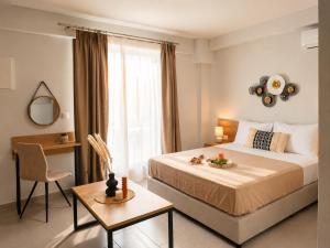 a bedroom with a large bed and a window at AISTHISIS Suites in Ierissos