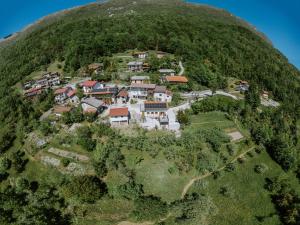 an aerial view of a house on a hill at Hiša Potoki in Kobarid