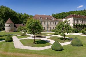 an image of a building with trees in the yard at Chambres d'hôtes l'allegra in Saint-Euphrône