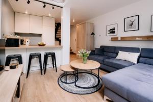 a living room with a couch and a table at Villa Pino in Borsk
