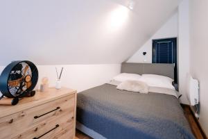 a bedroom with a bed and a wooden dresser at Villa Pino in Borsk +56 photos