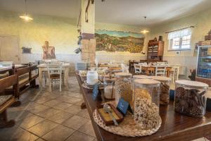 a room filled with tables and chairs in a store at TORRE QUADRANA in Spello