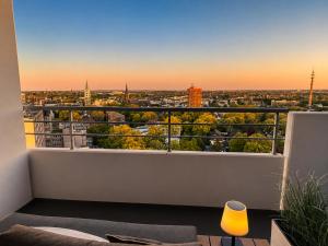 a balcony with a view of a city at Themenpartment privater SPA in Gelsenkirchen
