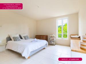 a bedroom with a white bed and a window at Mas provençal - Idéal familles & amis - Piscine privée - 3 suites - Avignon & Châteauneuf-du-Pape - Parking privé gratuit in Bédarrides +38 photos