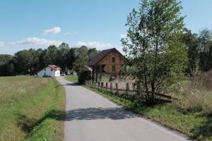 a road leading to a house in a field at Ethno holistic village Apače - Nature Retreat in Slovenia in Apače
