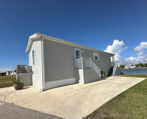 a small house with a ramp leading up to it at Lake Front, Beach Retreat in Fort Myers Beach