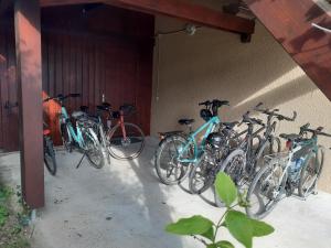 a group of bikes parked next to a wall at Le Temps d'une Pause in Andert-et-Condon