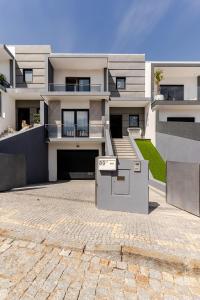 a large house with a parking lot in front of it at Casa entre Rios in Alpendurada