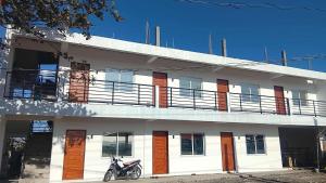 a motorcycle parked in front of a building at Hidalgo Lodge in Santa Ana +17 photos