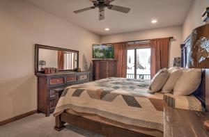 a bedroom with a bed with a dresser and a mirror at Elkpoint Unit 11 in Durango Mountain Resort +36 photos