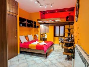 a bedroom with a bunk bed with red and yellow walls at Le Segrete del Sangallo in Civita Castellana
