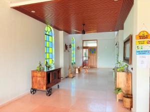 a room with a wooden chest in a room with stained glass at Eternal Bliss By Ganga Blessing in Rishīkesh