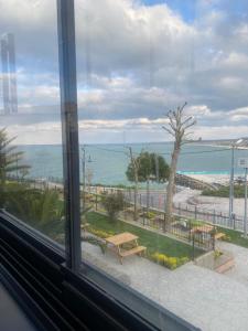 a view of the ocean from a window at AirPort geust house in Arnavutköy