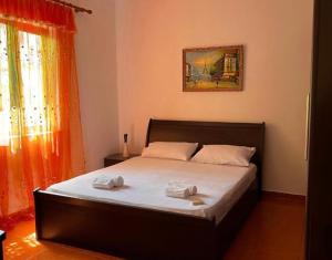 a bedroom with a bed with two towels on it at Berat Private Appartment in Haxhialiu Villa in Berat