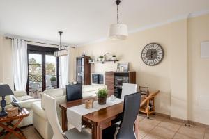 a living room with a table and a couch at coto 4 11 in Novo Sancti Petri