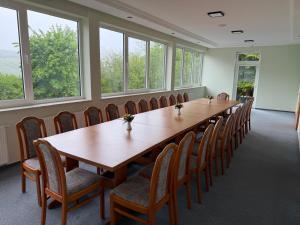a large conference room with a long table and chairs at Wald Hotel in Kirschweiler