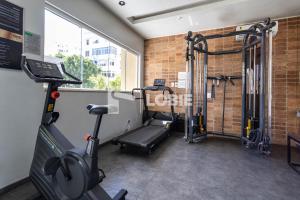 a room with a gym with a treadmill at Lobie Queen Ipanema in Rio de Janeiro