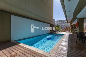 a swimming pool in the side of a building at Lobie Queen Ipanema in Rio de Janeiro