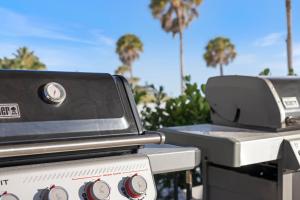 two bbqurgers with palm trees in the background at Sea Crest in Sarasota