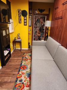 a living room with a couch and a rug at Snugnuff in South Burlington